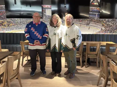 Mayor Berry Vrbanovic posing for a photo in Club 51 with the owners of the restaurant
